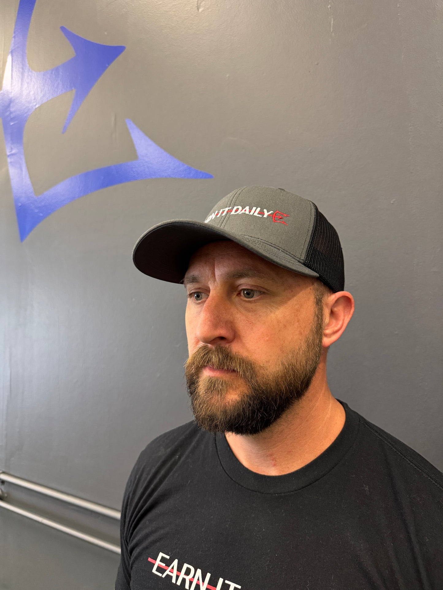 Earn It Daily Trucker Hat